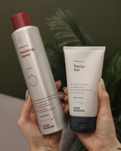 Parturi-kampaajan käsissä Four Reasons tuotteet: Finishing Spray ja Design Gel